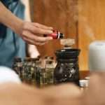 Ayurveda Aromatherapy Massage, Pouring Aromatic Oil in Essential Oil Diffuser
